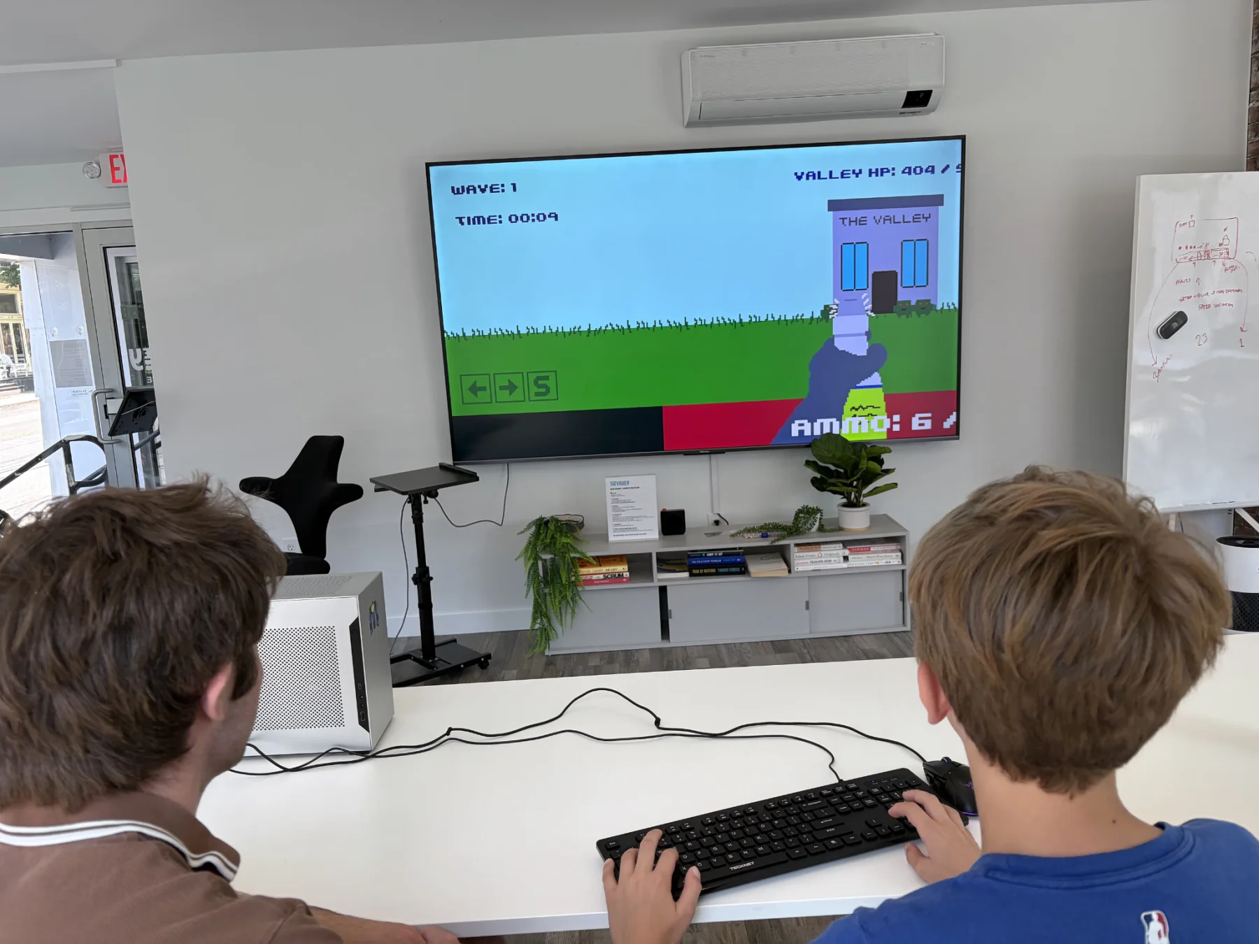 Teddy play-testing Clean Defense with Charlie at The Valley Hub
